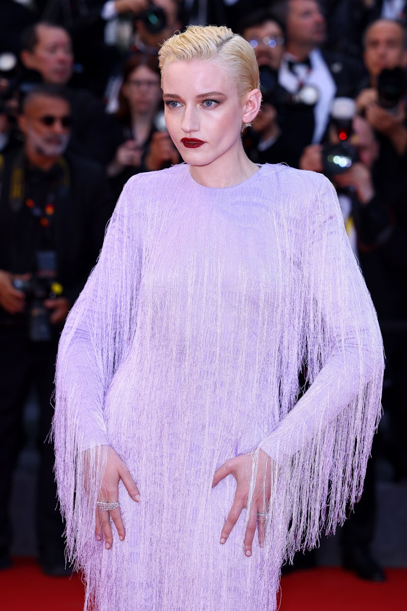 Julia Garner attends the "Eddington" red carpet at the 78th annual Cannes Film Festival at Palais de...