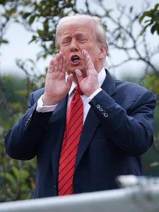 WASHINGTON, DC - AUGUST 05: U.S. President Donald Trump shouts answers to questions from reporters a...