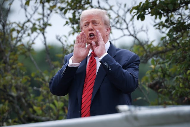 WASHINGTON, DC - AUGUST 05: U.S. President Donald Trump shouts answers to questions from reporters a...