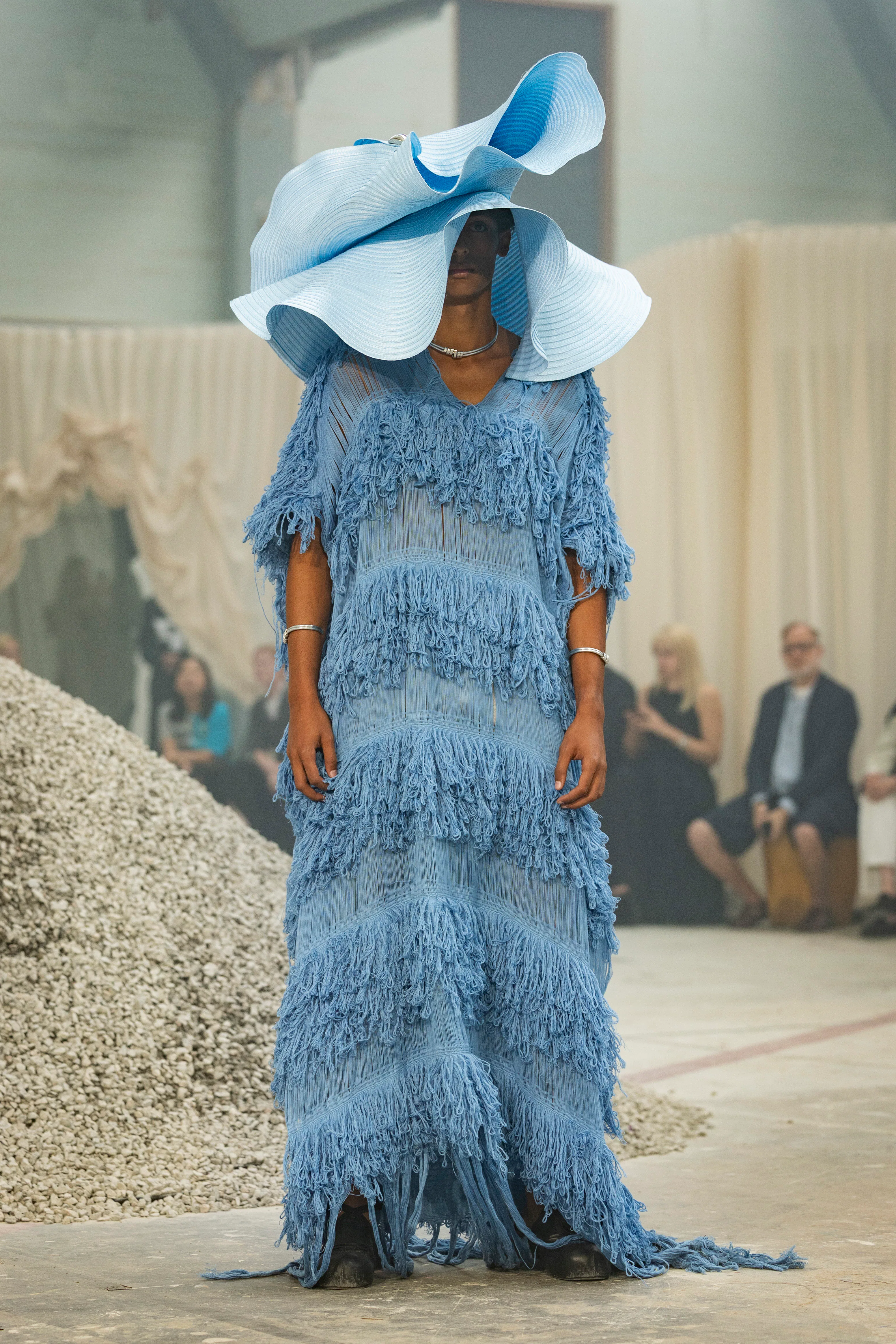 A model poses on the runway at the IAMISIGO show