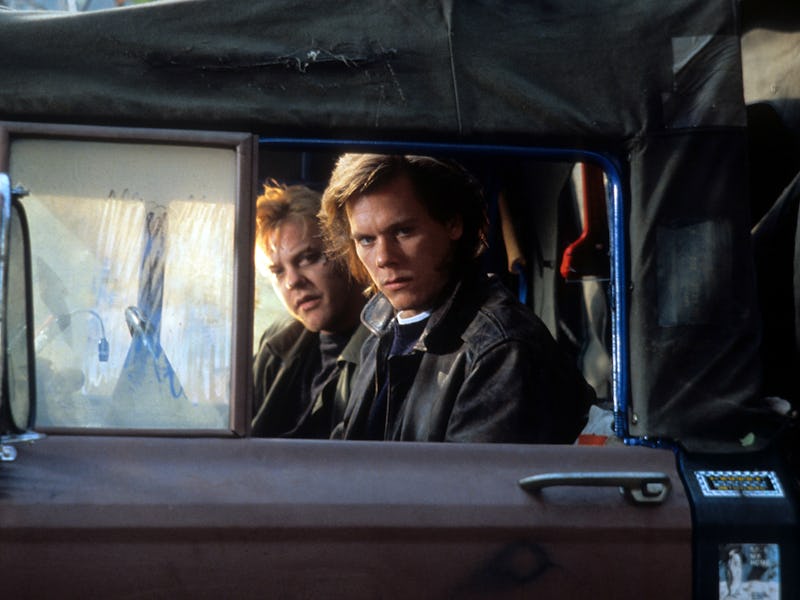 Kiefer Sutherland and Kevin Bacon looking from truck in a scene from the film 'Flatliners', 1990. (P...