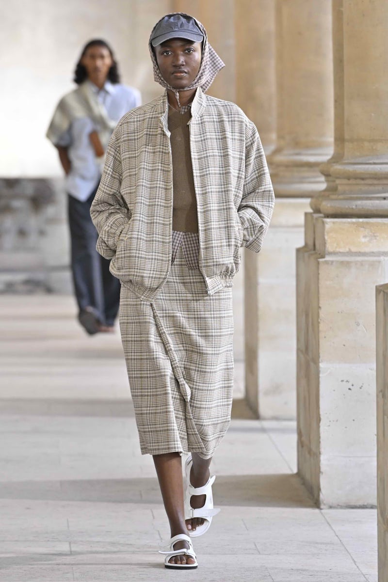 PARIS, FRANCE - JUNE 24: A model walks the runway during the Auralee Ready to Wear Spring/Summer 202...