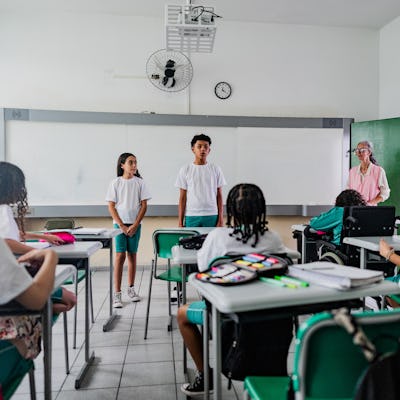 Elementary students speaking in front of class