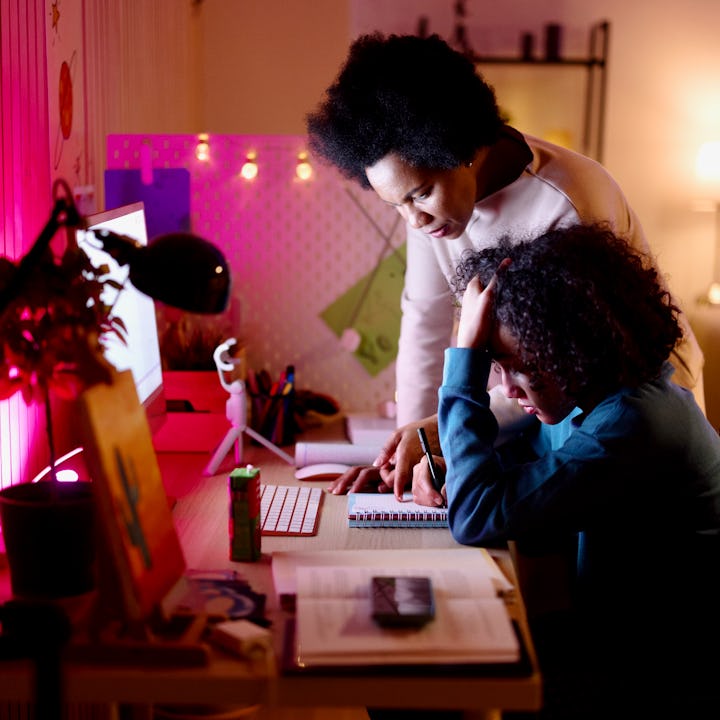 Mother helping her son with homework
