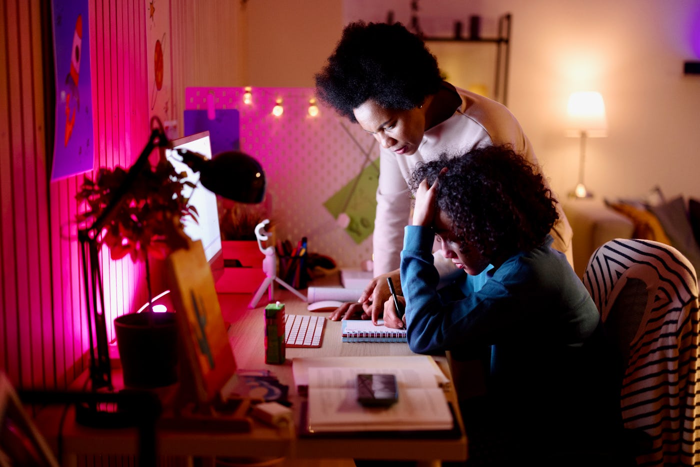 Mother helping her son with homework