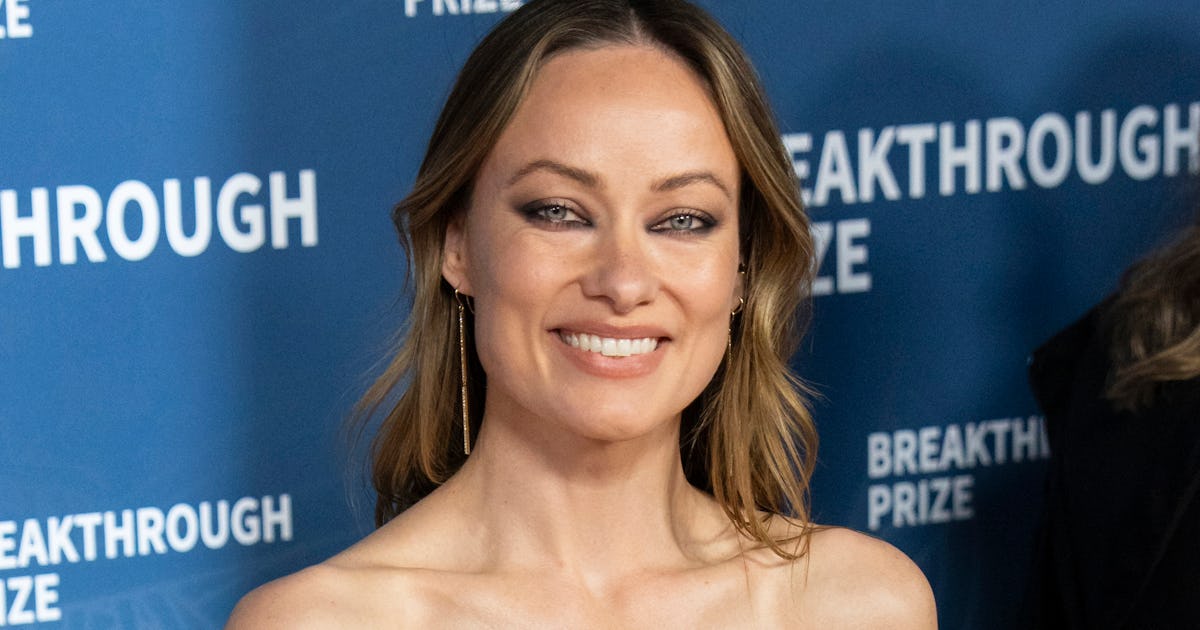 Olivia Wilde Went Braless In A Plunging Suit & It's Giving Carrie Bradshaw
