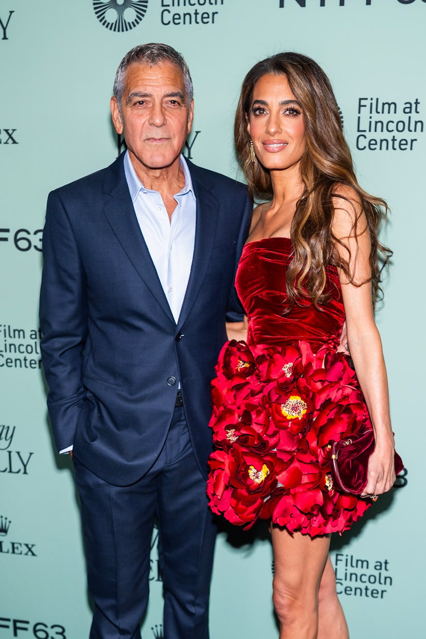 George Clooney (L) and Amal Clooney attend the "Jay Kelly" red carpet during 63rd New York Film Fest...