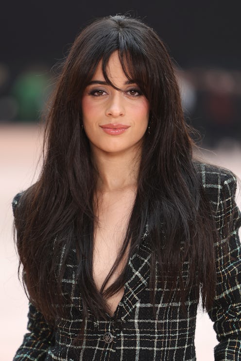 Camila Cabello wore a skimpy cutout dress in 'Showgirl' orange.