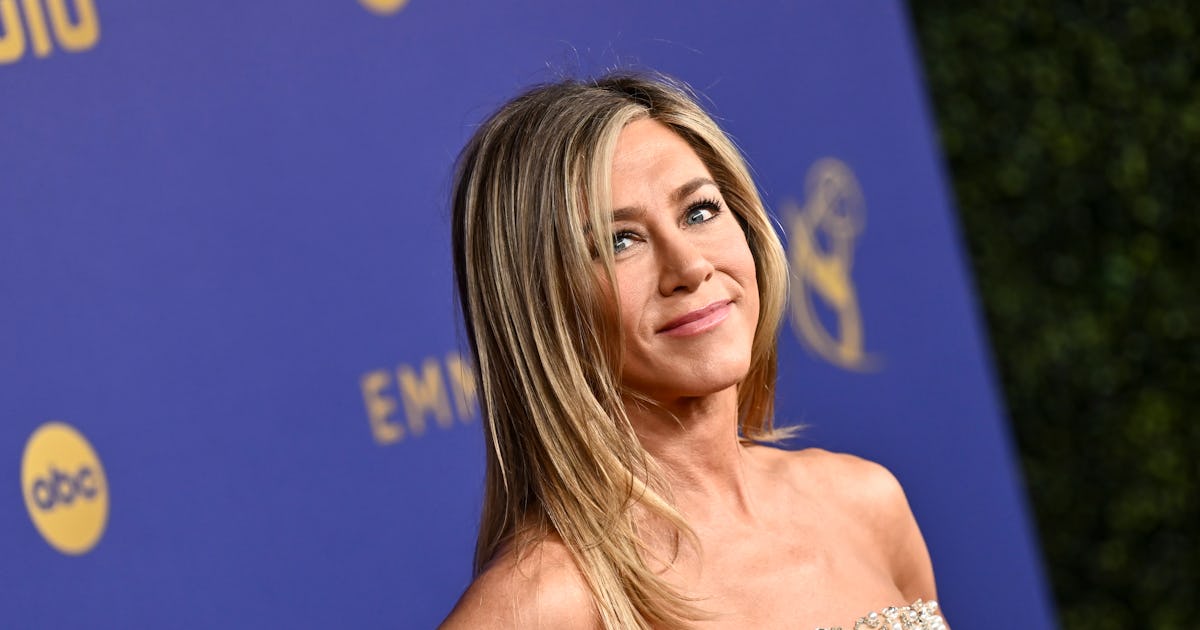 Jennifer Aniston Embraced The "Corpcore" Trend In A Plunging Slip Dress