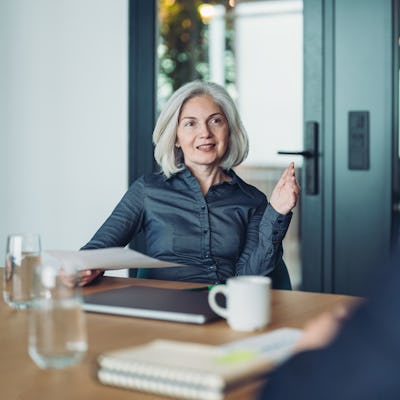 Focus on a mature businesswoman during a meeting