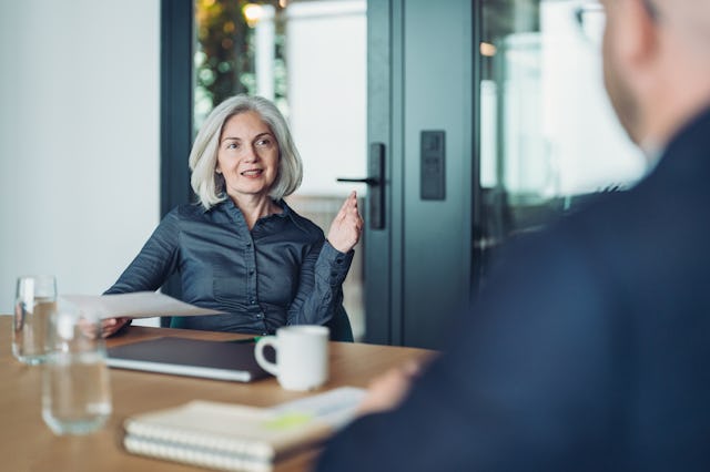Focus on a mature businesswoman during a meeting