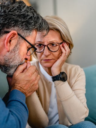 Mature man supporting his wife during a difficult time at home