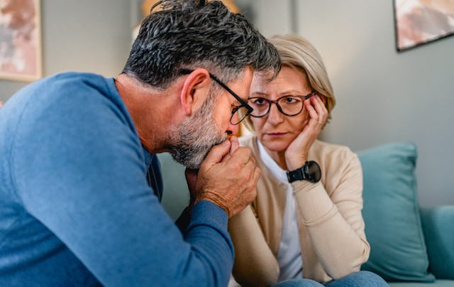 Mature man supporting his wife during a difficult time at home