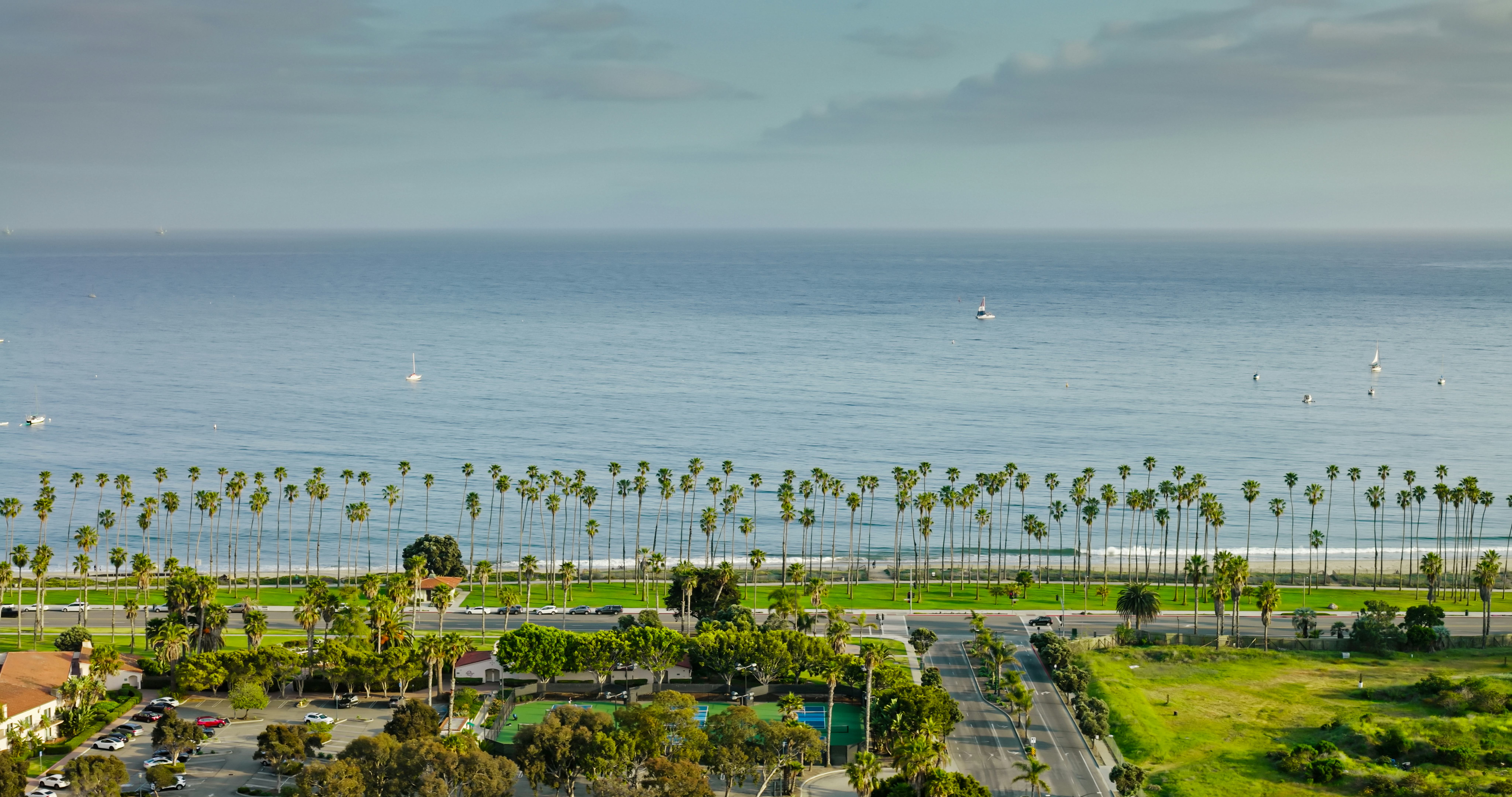 Aerial establishing shot of Pacific Ocean taken from Santa Barbara, California on sunny day.