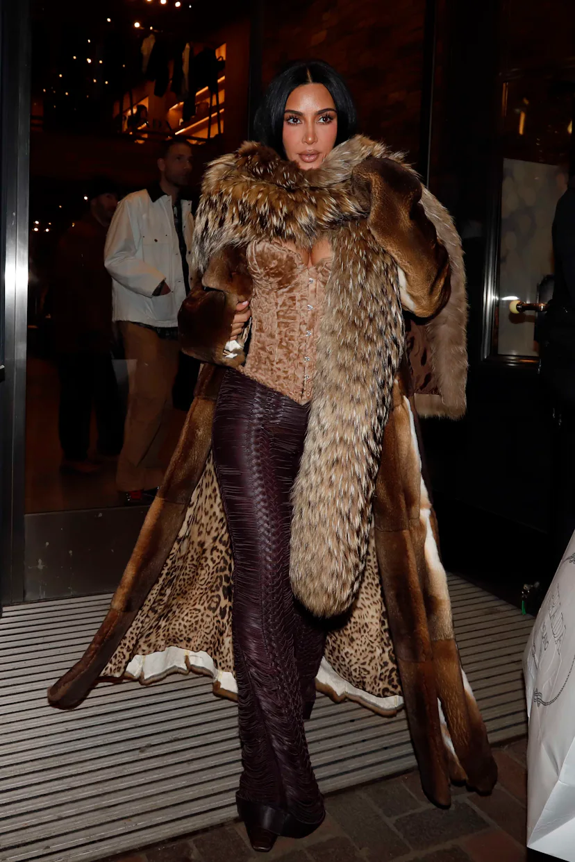 kim kardashian new years eve dress Kim Kardashian shared a few pictures from her New Year Eve look and captioned her post, "NYE". Kardashian looked breathtaking in a thigh-high black sheer sequin dress with a halter neck, which