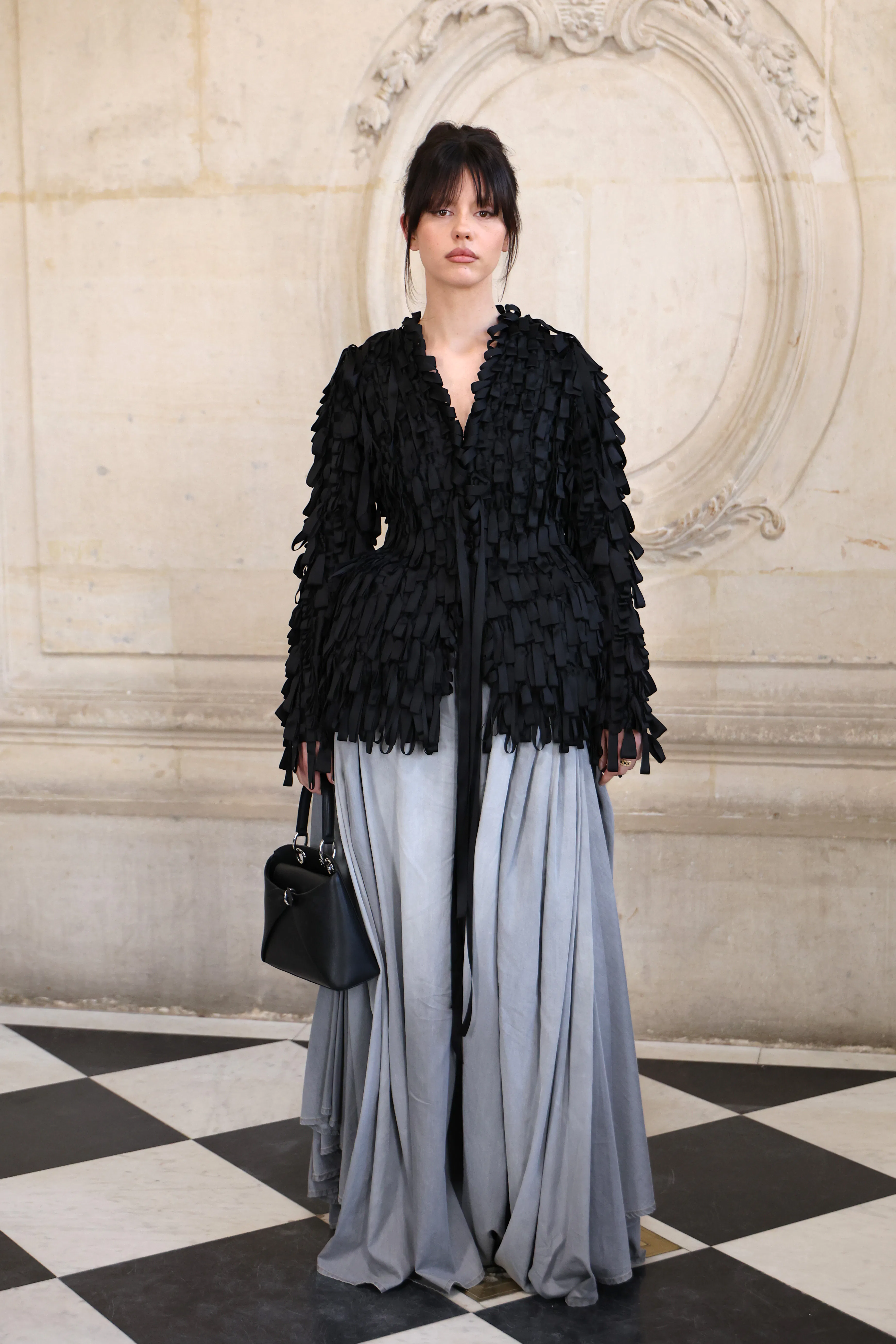Mia Goth Brings the Pickpocket Bag to Paris Fashion Week