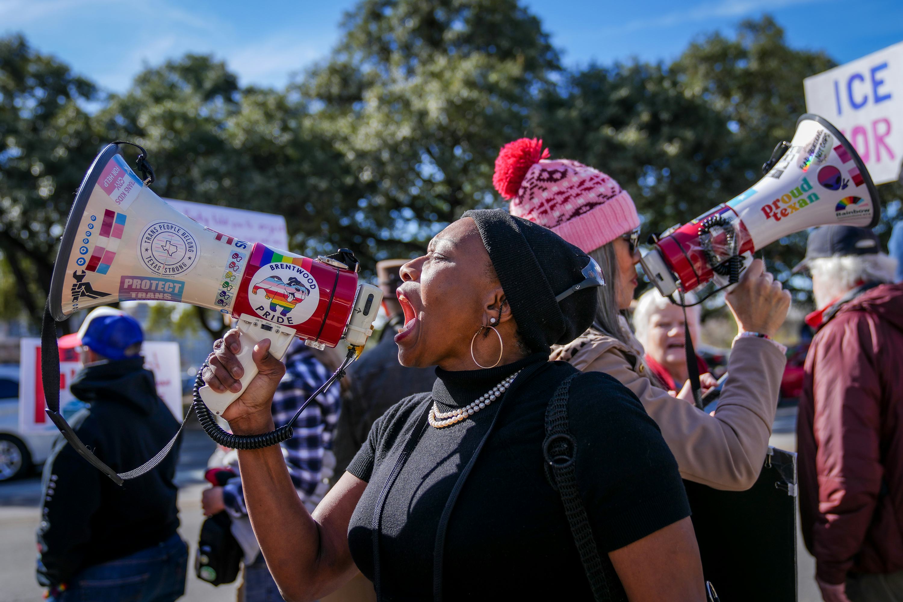 AUSTIN, TEXAS - JANUARY 10: Joycelyn Henderson leads chants on the bullhorn during a rally at Austin...