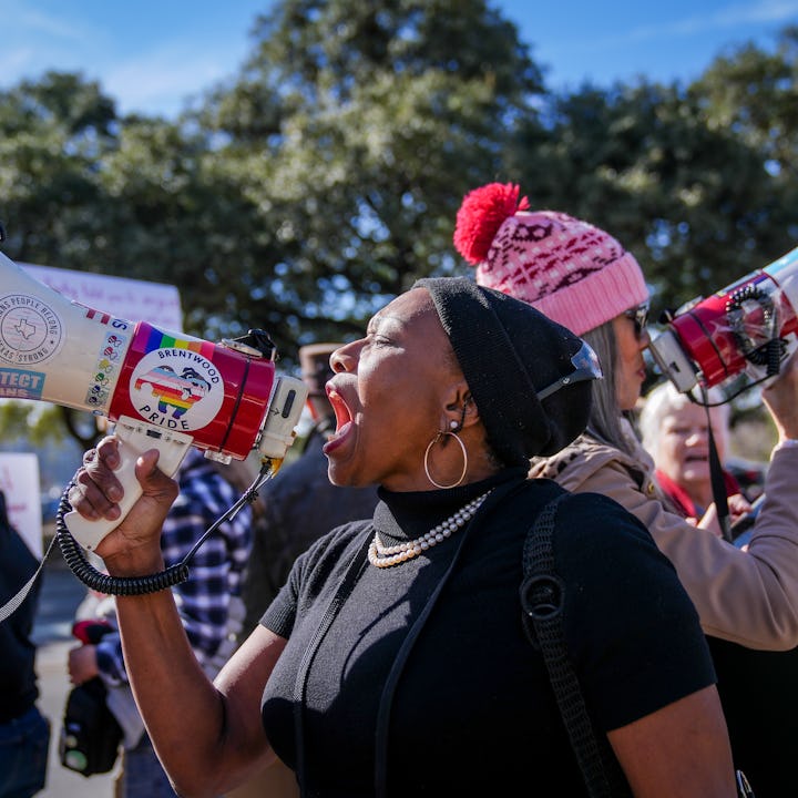 AUSTIN, TEXAS - JANUARY 10: Joycelyn Henderson leads chants on the bullhorn during a rally at Austin...