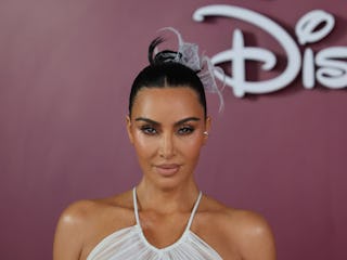 Kim Kardashian explains posting and later deleting a photo with Meghan Markle.