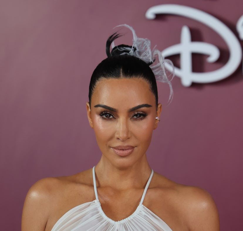 Kim Kardashian explains posting and later deleting a photo with Meghan Markle.