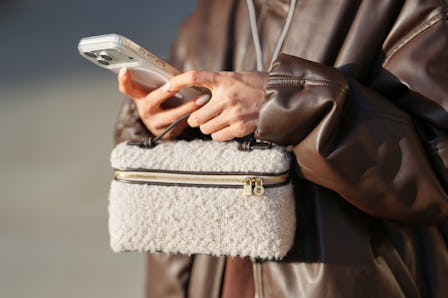 Yuwei Zhangzou on her phone