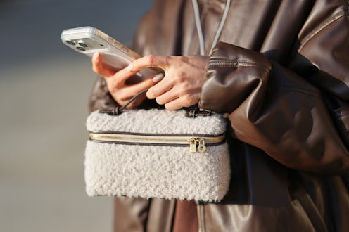 Yuwei Zhangzou on her phone