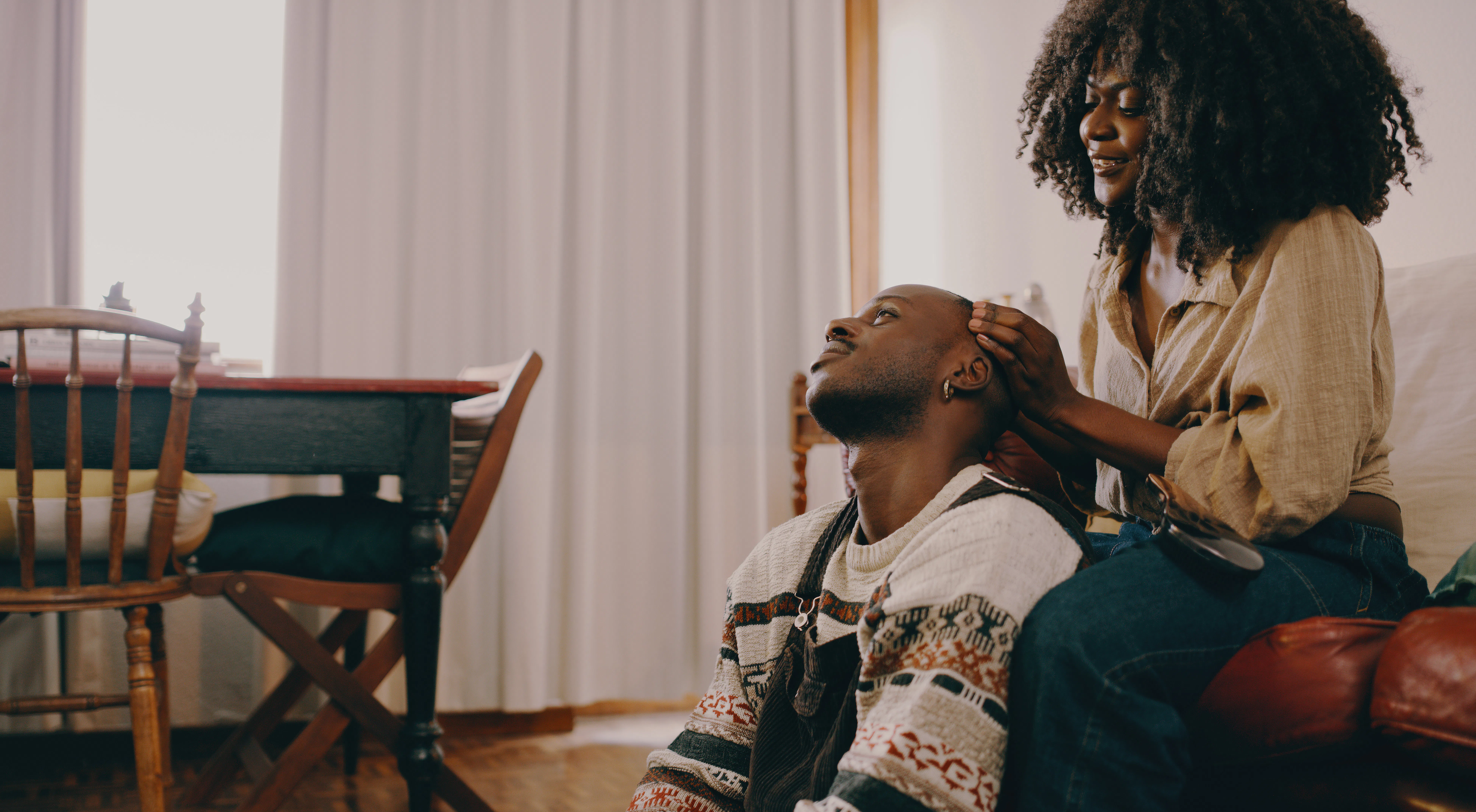 Shot of a young couple spending quality time in the living room at home