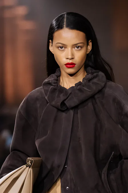 A model at the Victoria Beckham show with a bold red lip