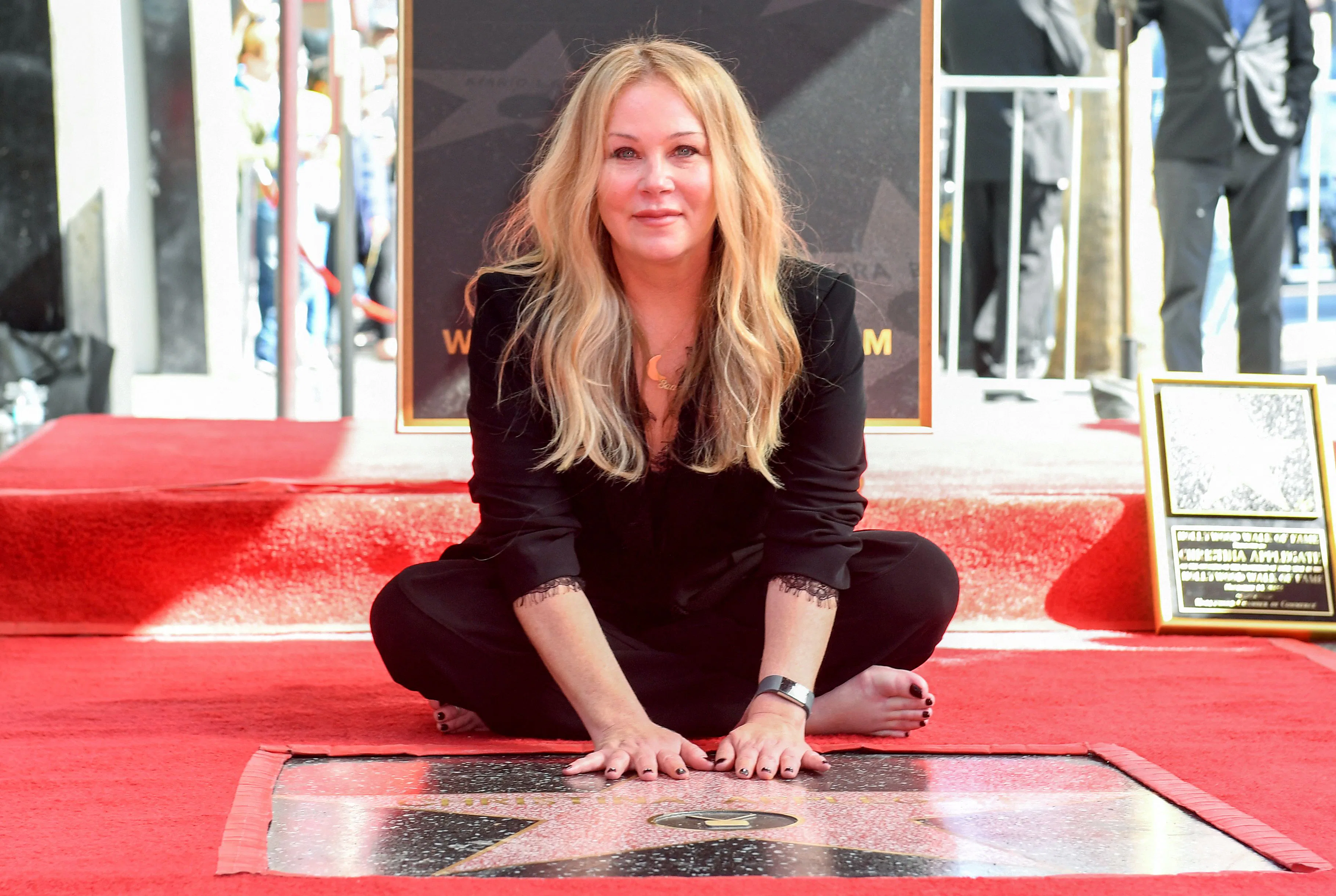 US actress Christina Applegate poses for photos with her newly unveiled Hollywood Walk of Fame star ...