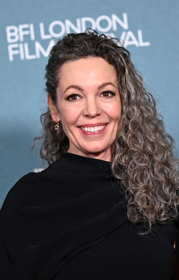Olivia Colman at the London premiere of "Wicker" with curly gray hair