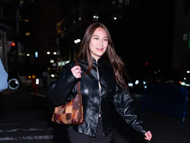 Lola Tung is seen in Midtown wearing Marc Fisher LTD boots.