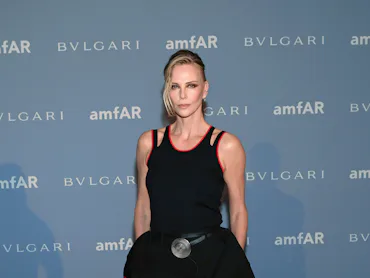 DALLAS, TEXAS - OCTOBER 24: Charlize Theron attends amfAR Dallas 2026 on October 24, 2026 in Dallas,...