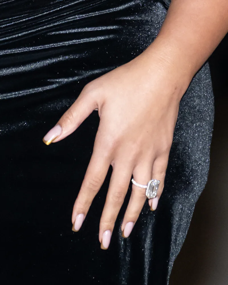 Close up of Jordyn Woods' gold french manicure