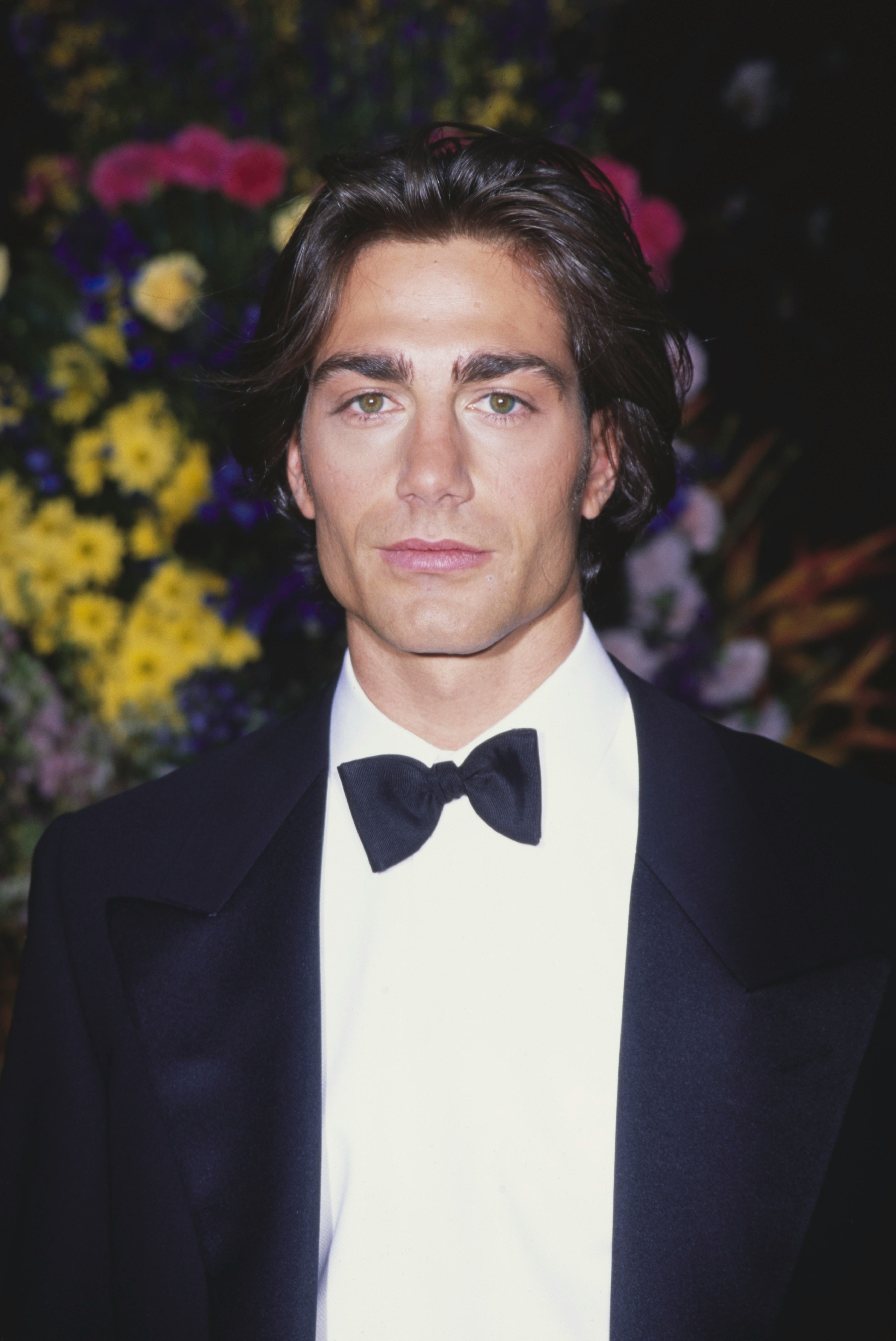 American actor and model Michael Bergin, wearing a tuxedo and bow tie, attends the 68th Annual Acade...