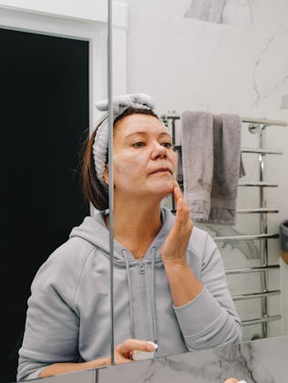 Middle age woman doing her morning beauty routine