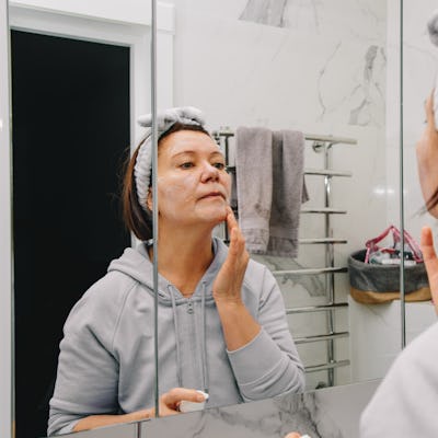 Middle age woman doing her morning beauty routine