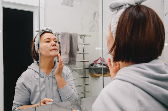 Middle age woman doing her morning beauty routine
