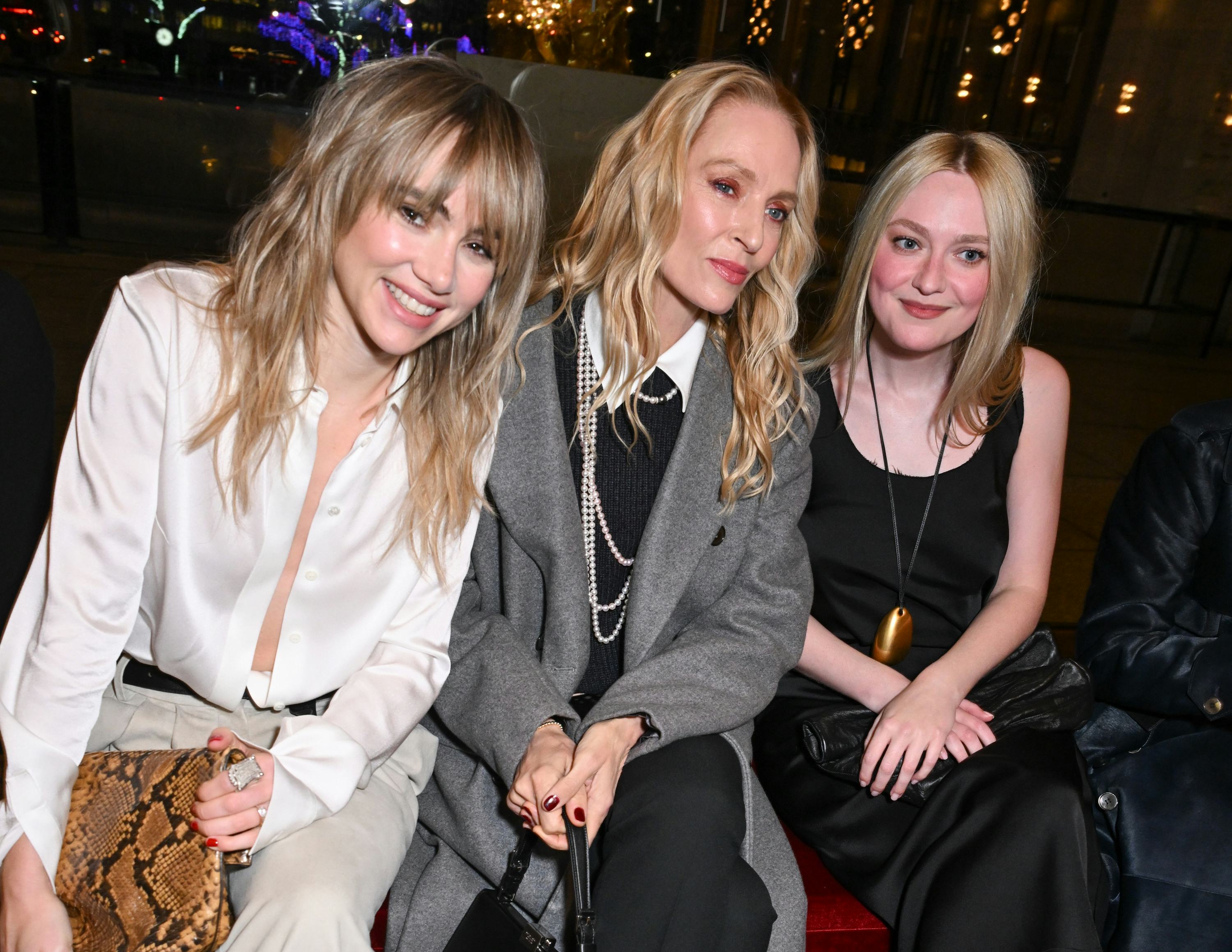Suki Waterhouse, Uma Thurman and Dakota Fanning at the Michael Kors fashion show as part of RTW Fall...
