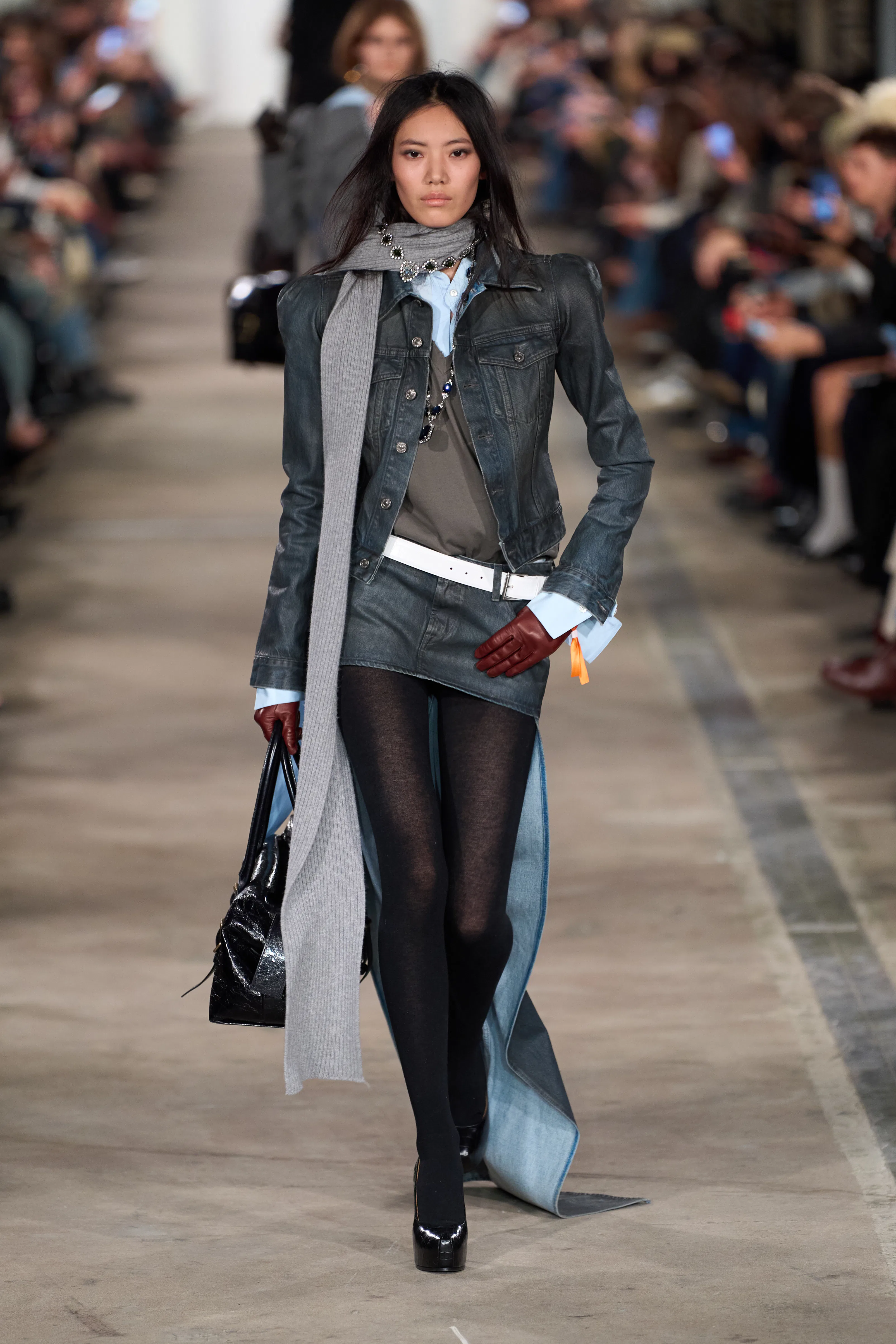 A model walks the runway for the 7 For All Mankind FW26 fashion show