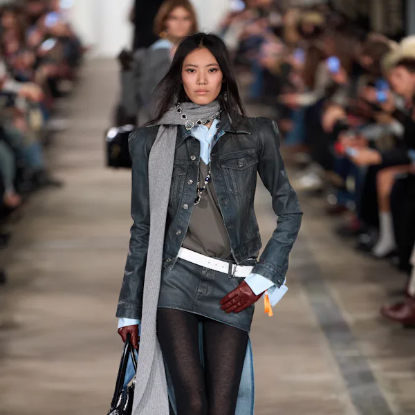 A model walks the runway for the 7 For All Mankind FW26 fashion show