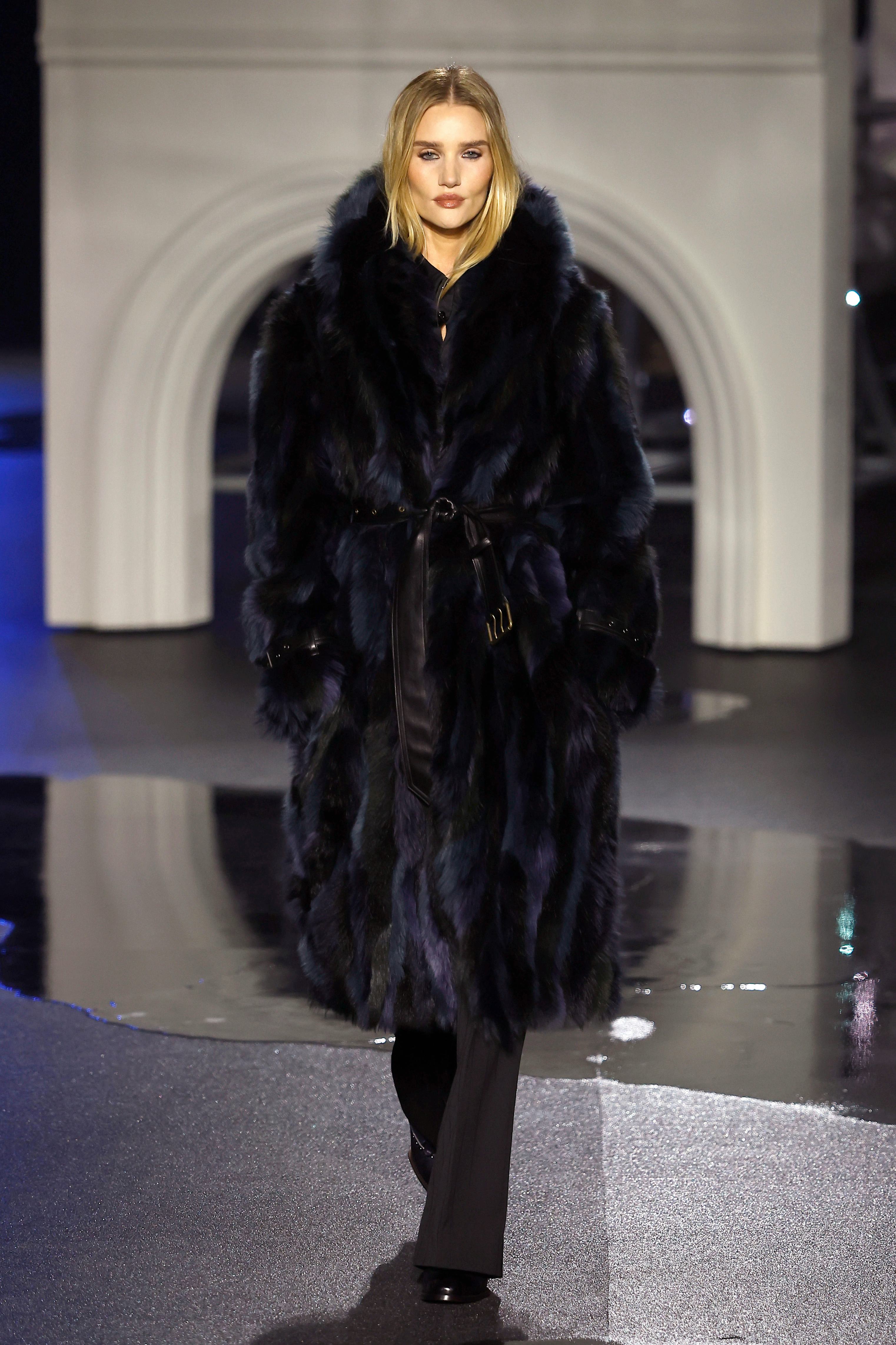 Rosie Huntington-Whitely walks the runway at the Burberry show during London Fashion Week 