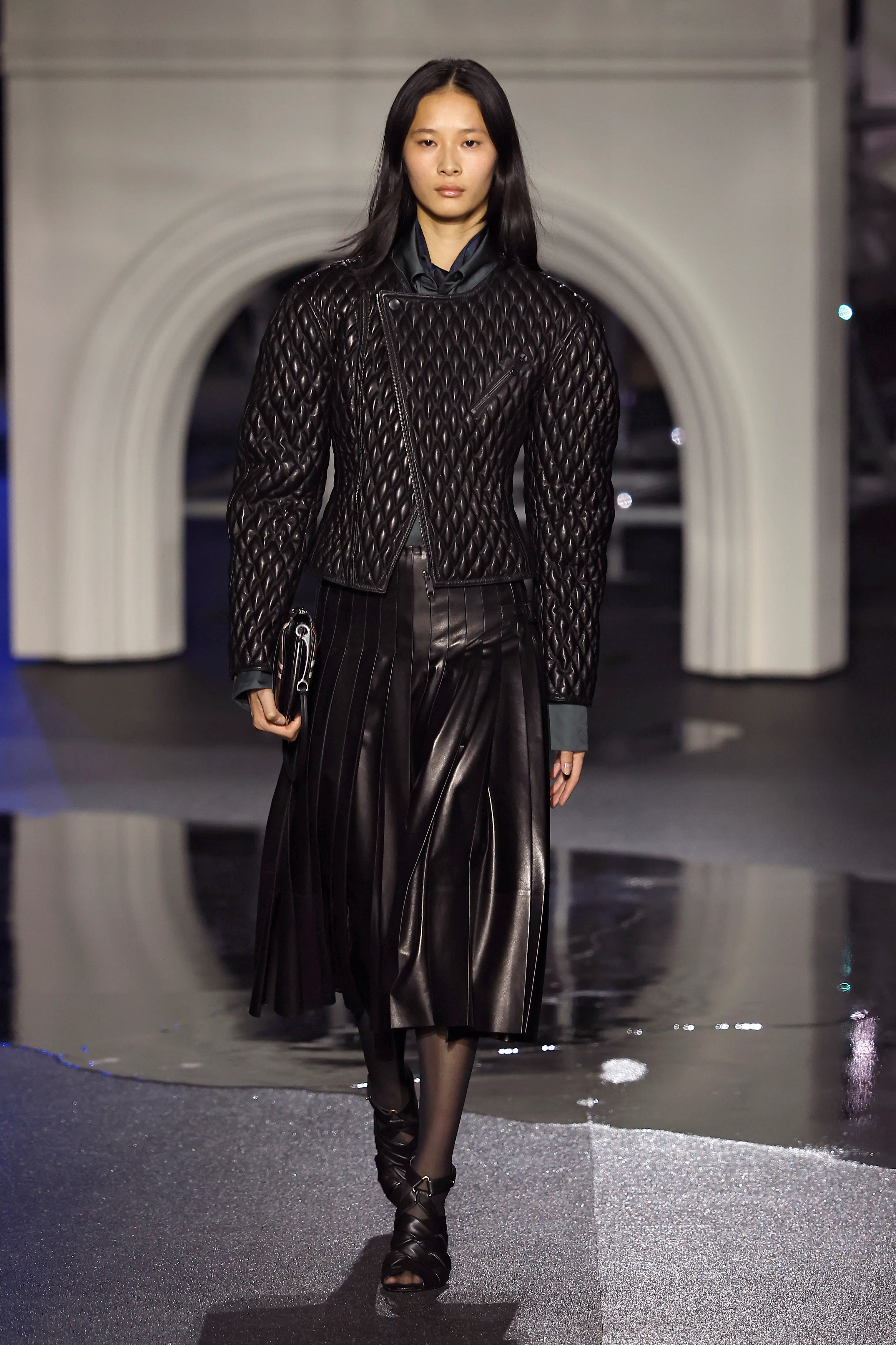 A model walks the runway at the Burberry show during London Fashion Week 