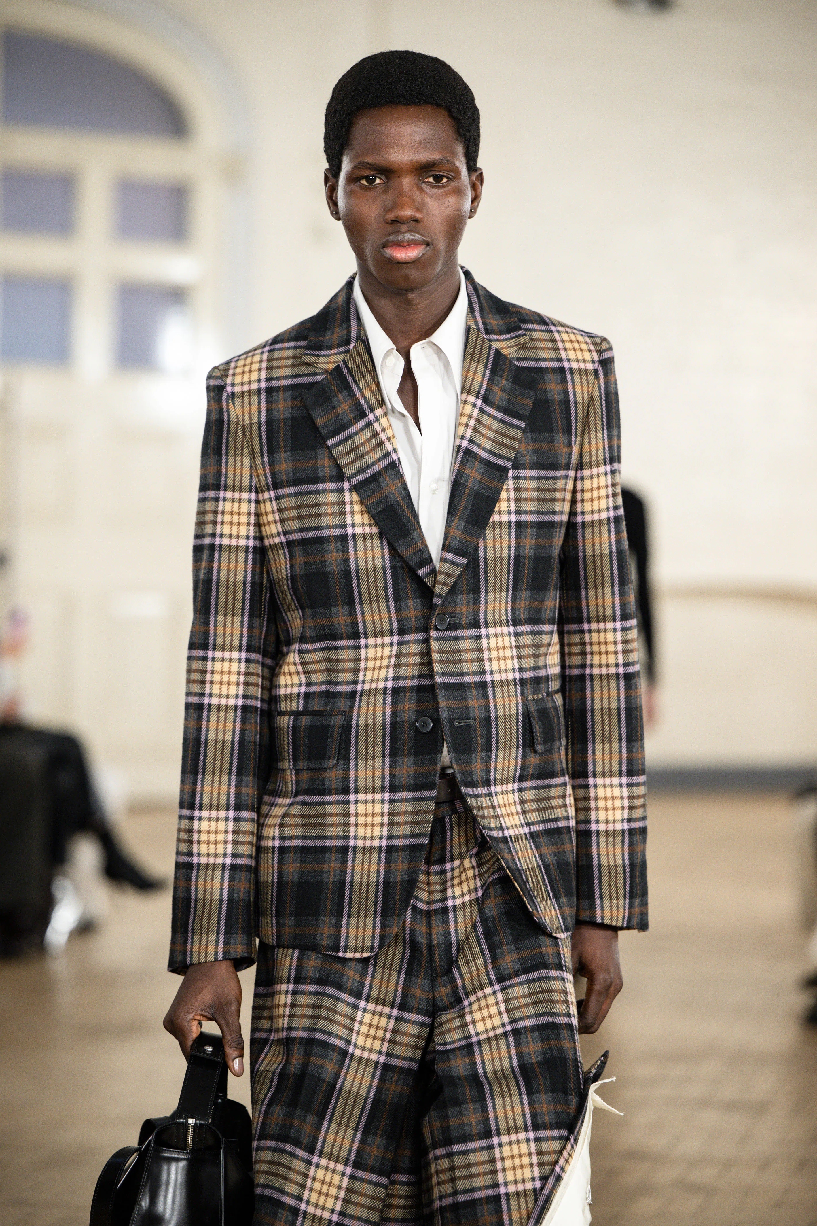 A model walks the runway at the Toga Ready to Wear Fall/Winter 2026