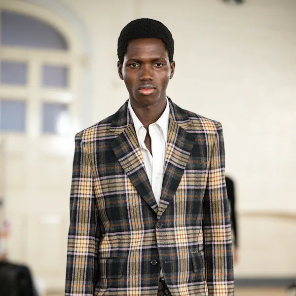 A model walks the runway at the Toga Ready to Wear Fall/Winter 2026