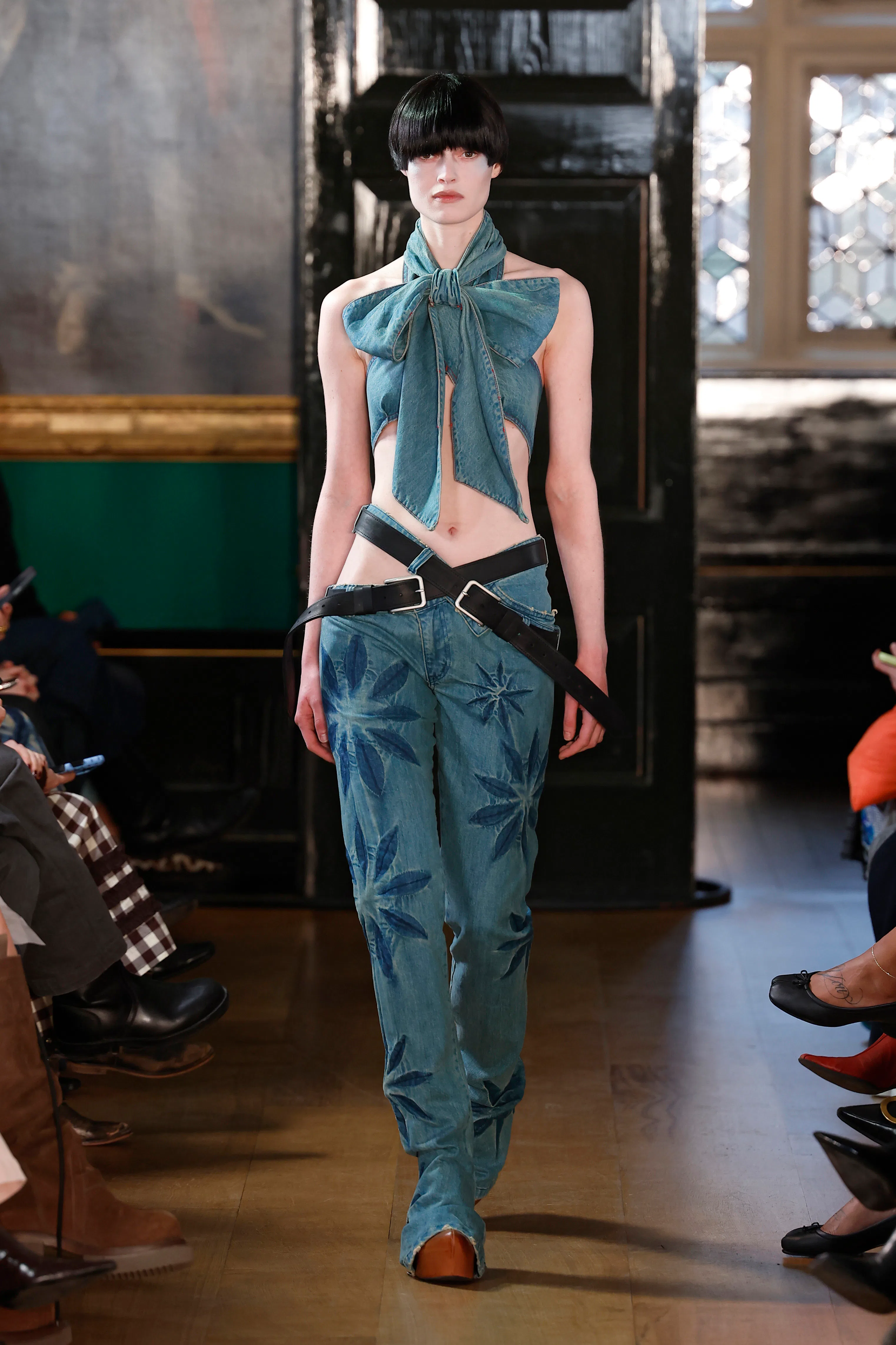 A model walks the runway at the Masha Popova show during London Fashion Week 