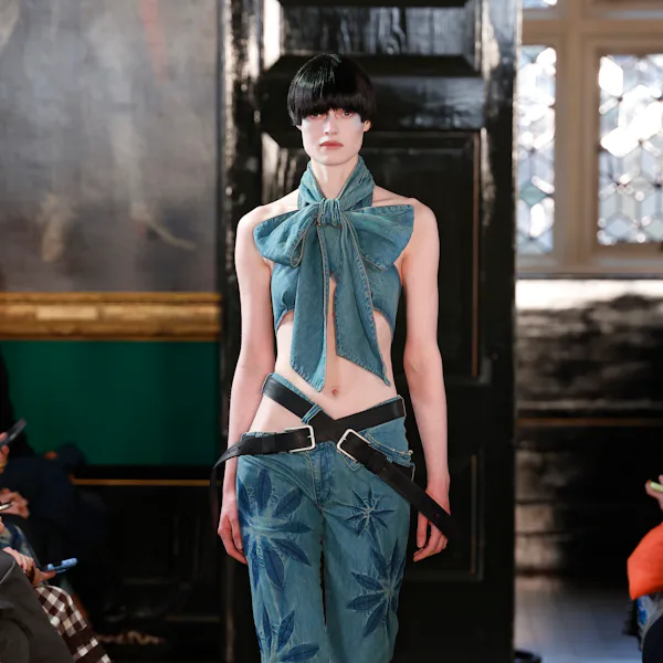 A model walks the runway at the Masha Popova show during London Fashion Week