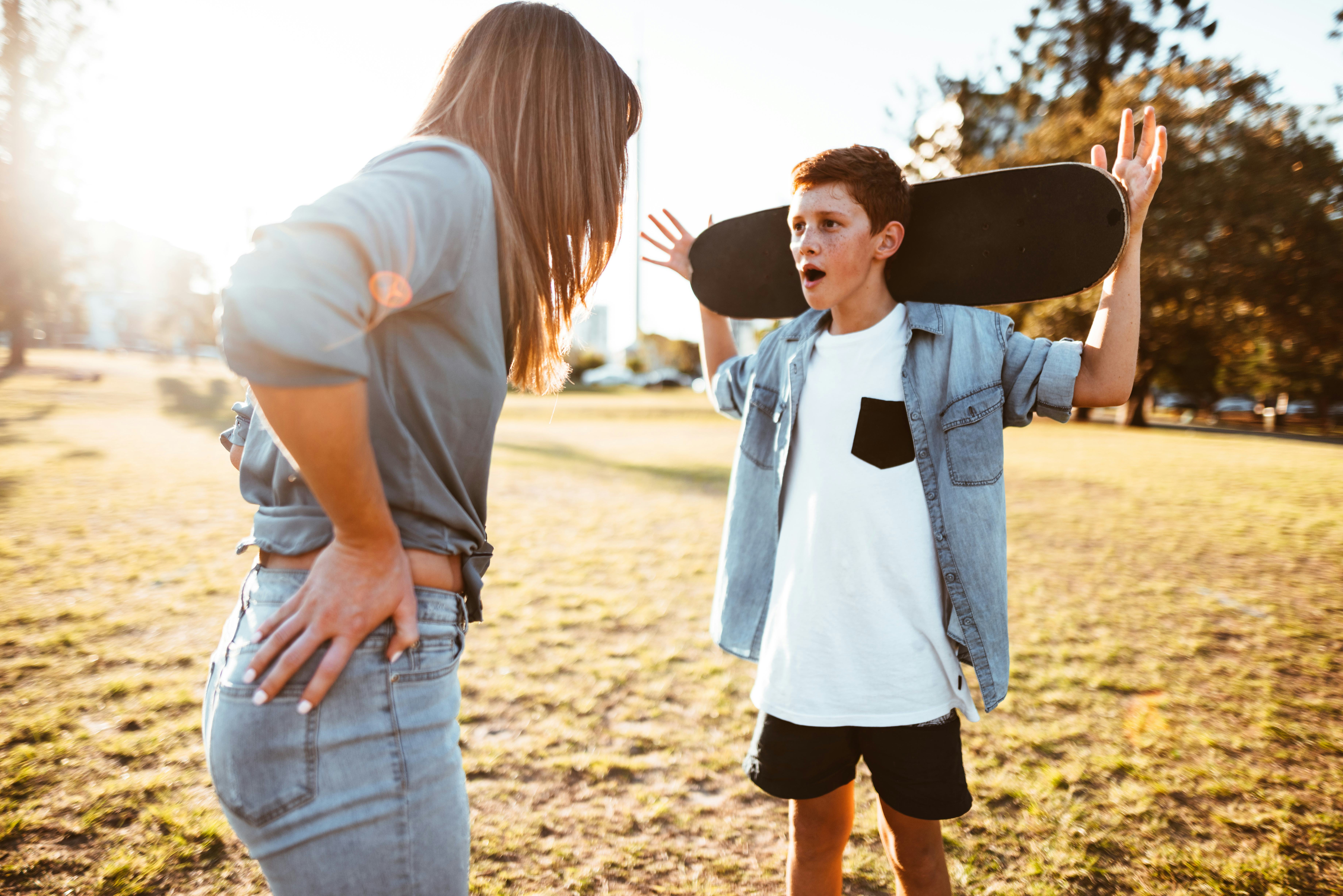 mother bothering the son with the skateboard