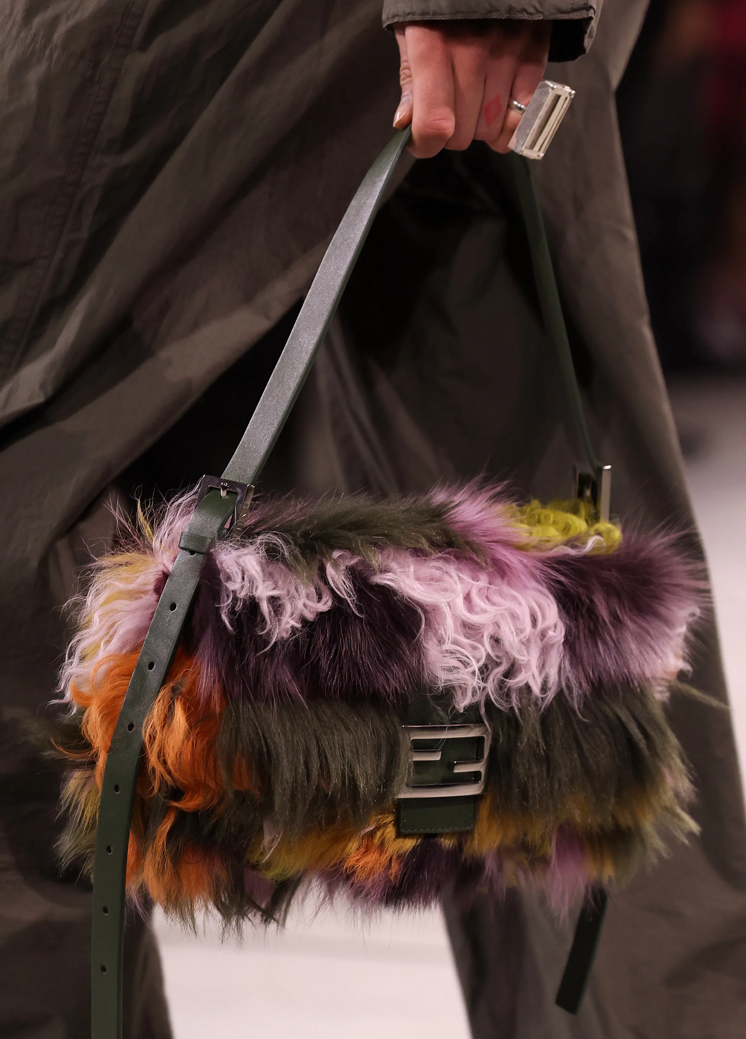 A model, bag detail, walks the runway at the Fendi fashion show during the Milan Fashion Week 