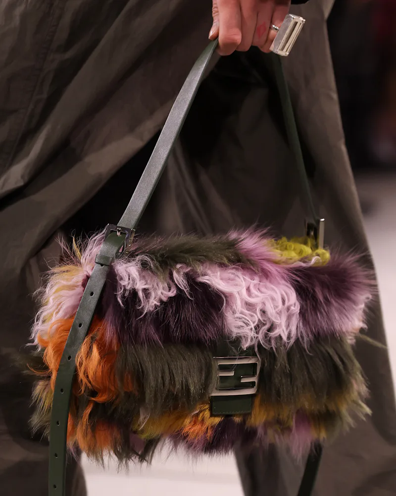 A model, bag detail, walks the runway at the Fendi fashion show during the Milan Fashion Week