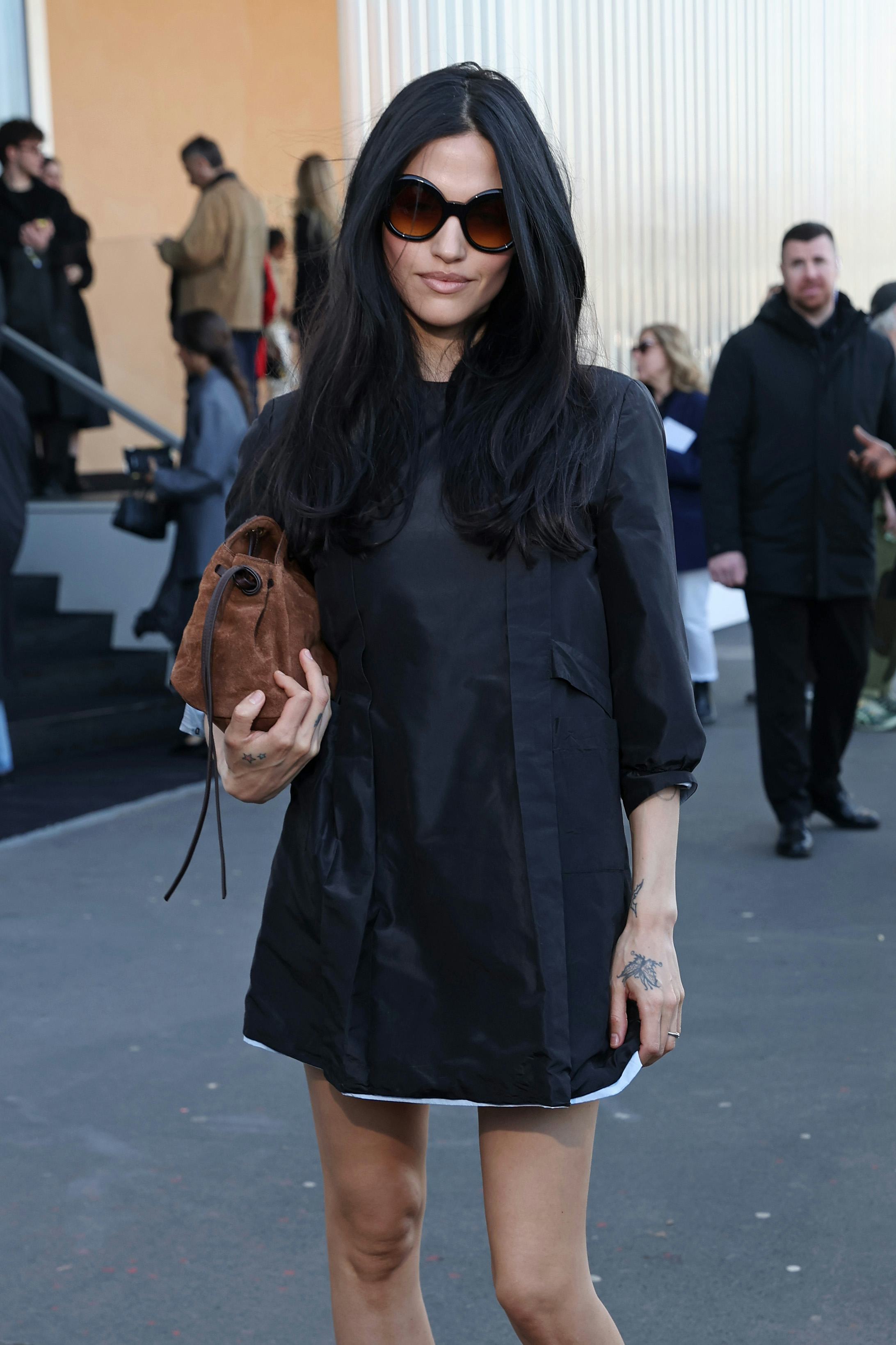 MILAN, ITALY - FEBRUARY 26: Gabbriette attends the Prada fashion show during the Milan Menswear Fall...